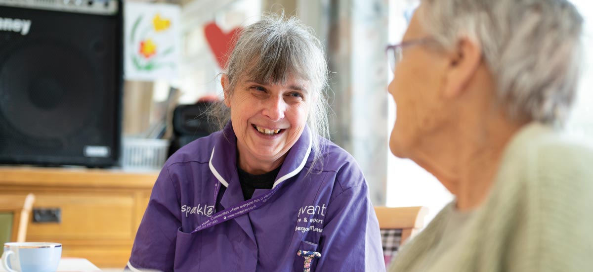 Carer and residents talking