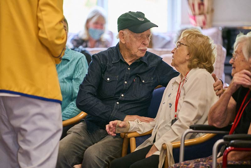 Actor Brian Murphy talking to a service user