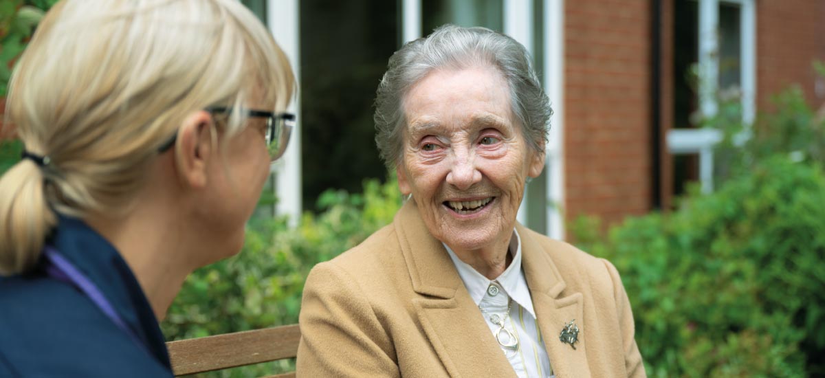 Carer and residents talking