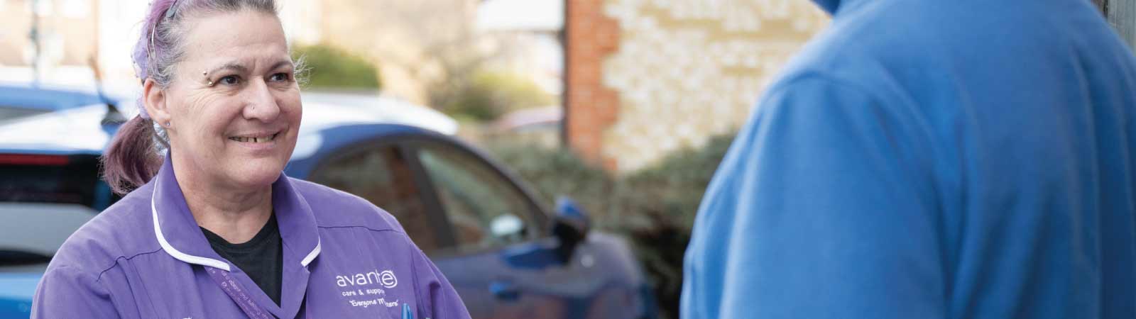 Carer greeting a resident