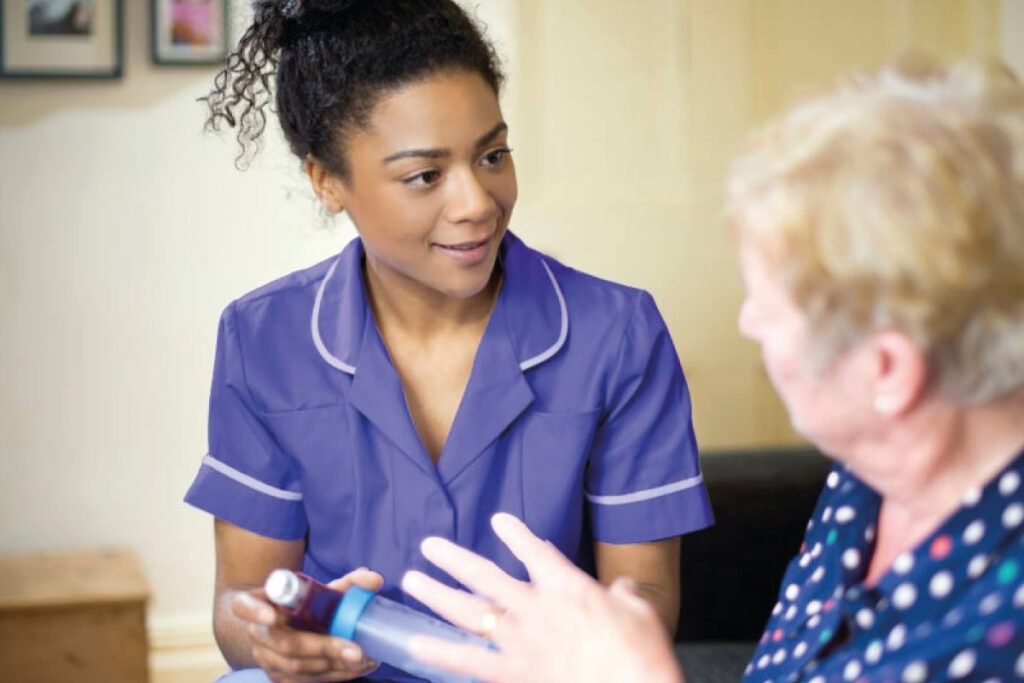 Home Carer helping a service user in her home