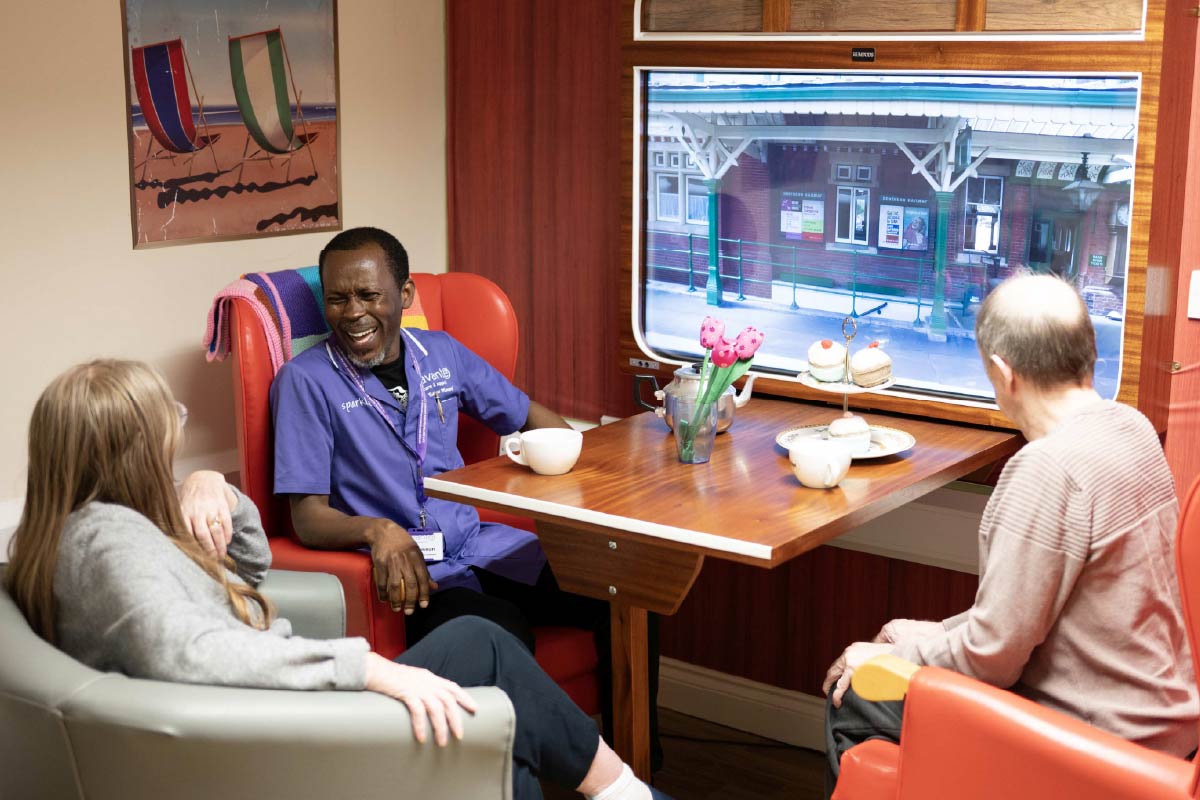 Avante Carer and residents enjoying a railway themed experience