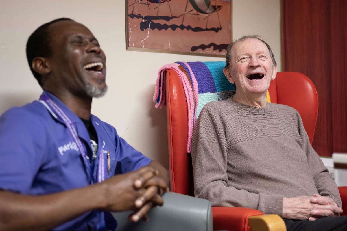 Resident and Avante Care laughing together