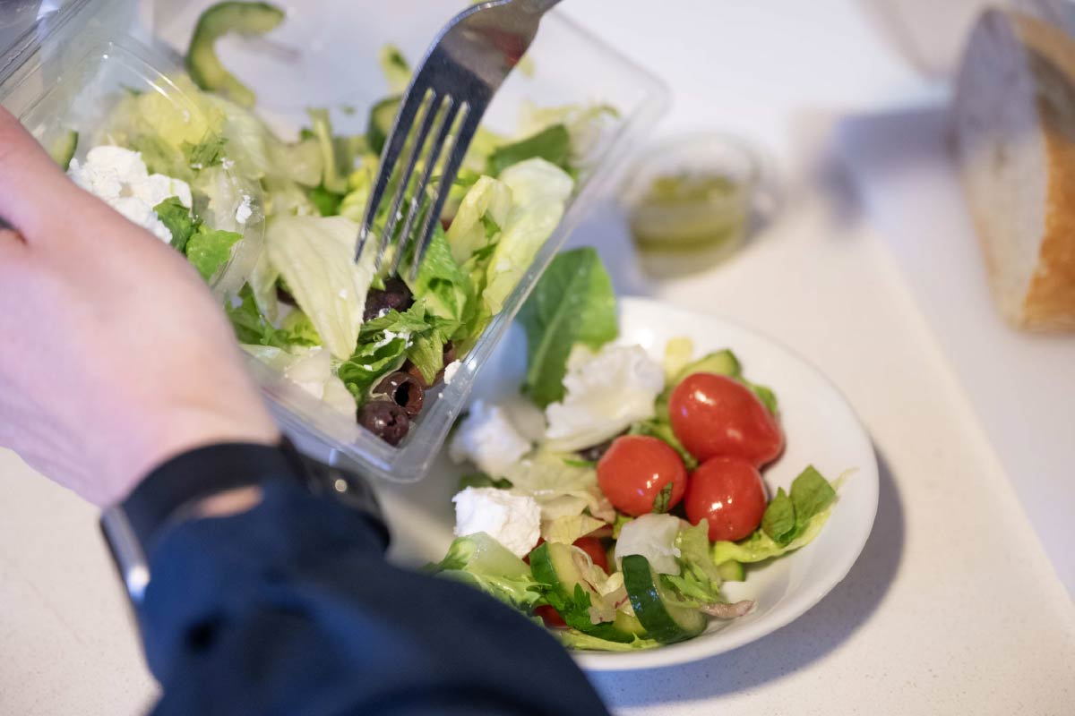 Avante Home Carer preparing a salad in a white bowl